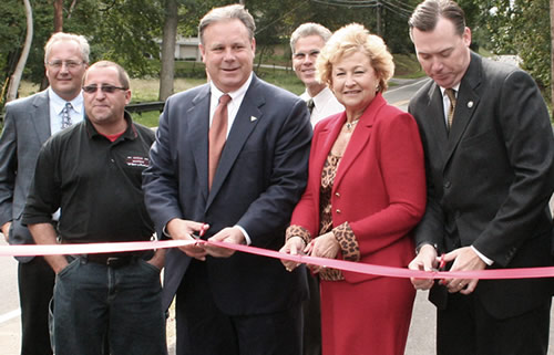 Officials dedicate the new bridge on Robertsville Road